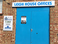 Doorway showing overhead sign and one to the left supplied and installed by Luxe Graphics, Desborough Sign company